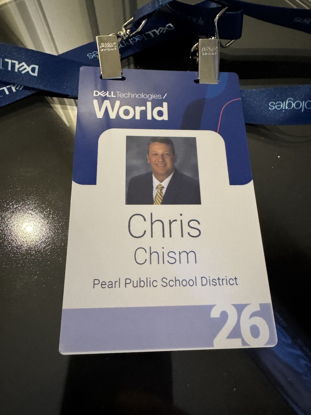 Dell Technologies World speaker badge displaying Chris Chism's name and photo